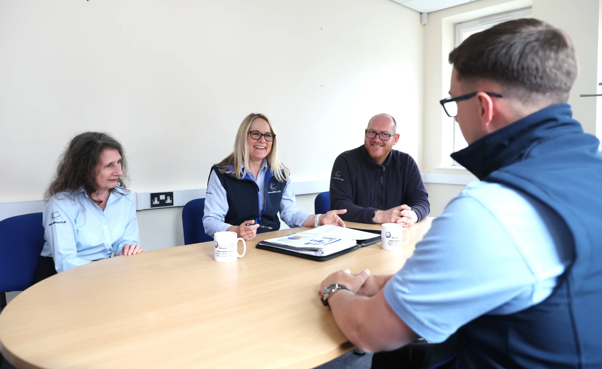 amita team in a conference room